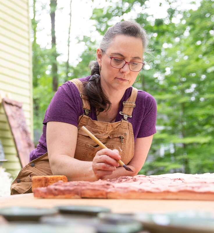 Val gilman, art coach, working on her art, surrounded by nature